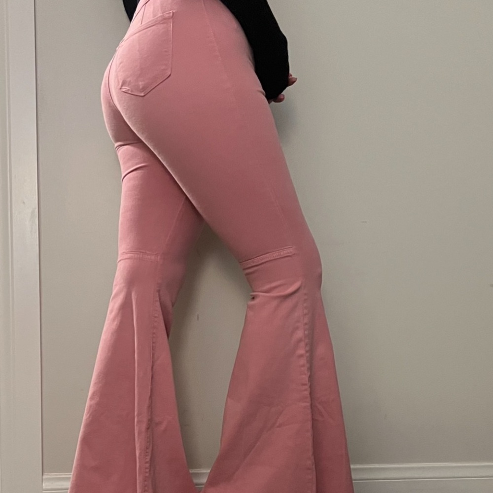 pink high waisted flare jeans super comfy has a stretchy jean material size 3